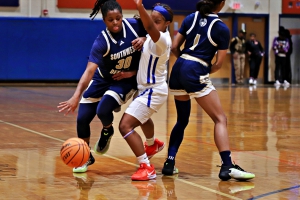 Southwest DeKalb's Saniya Rice (30) dribbles to get past Columbia defender Deasia Kelly (middle) who is trying to get around a screen by Rice teammate Chance Alexander. (Photo by Mark Brock)